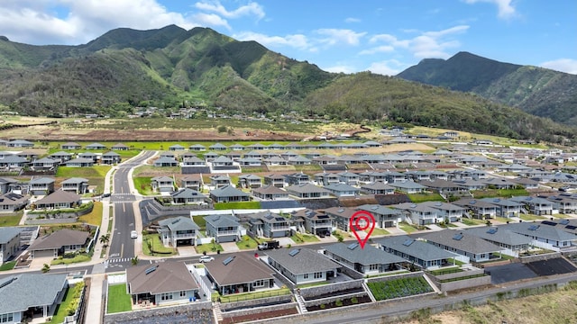 view of property location featuring a mountainous background and nearby suburban area