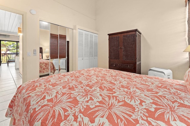 bedroom featuring light tile patterned floors and access to exterior