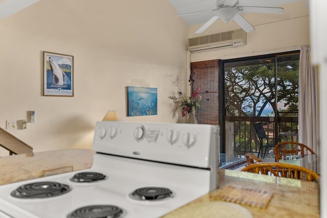 interior space featuring white range, an AC wall unit, vaulted ceiling, and ceiling fan