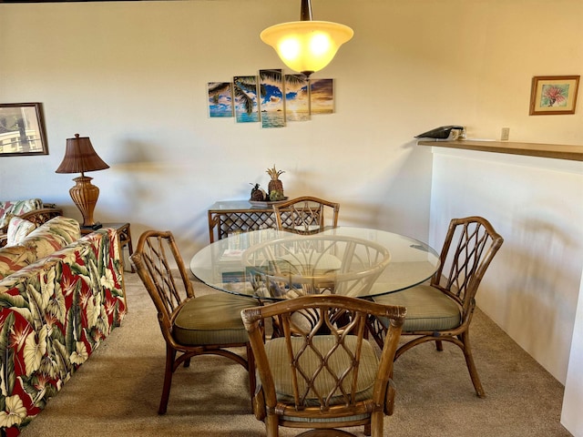 view of carpeted dining area