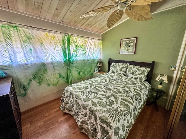 bedroom with ceiling fan, wood ceiling, wood-type flooring, and vaulted ceiling