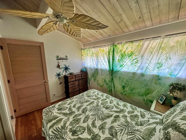 bedroom with lofted ceiling, ceiling fan, hardwood / wood-style floors, and wood ceiling