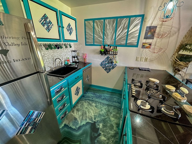 kitchen with appliances with stainless steel finishes and sink