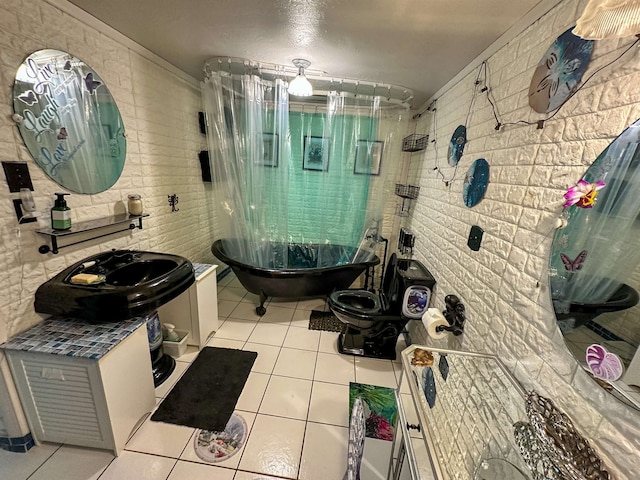 bathroom with vanity, toilet, and tile patterned floors