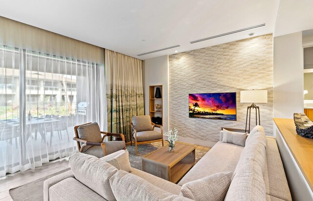 living room featuring hardwood / wood-style flooring and a fireplace