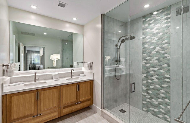 bathroom with vanity, tile patterned floors, and walk in shower