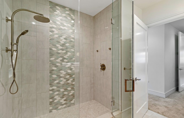 bathroom featuring tile patterned flooring and an enclosed shower