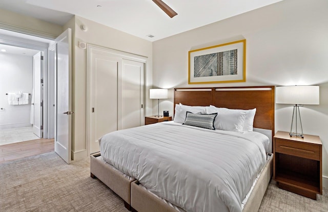 bedroom featuring ceiling fan and connected bathroom