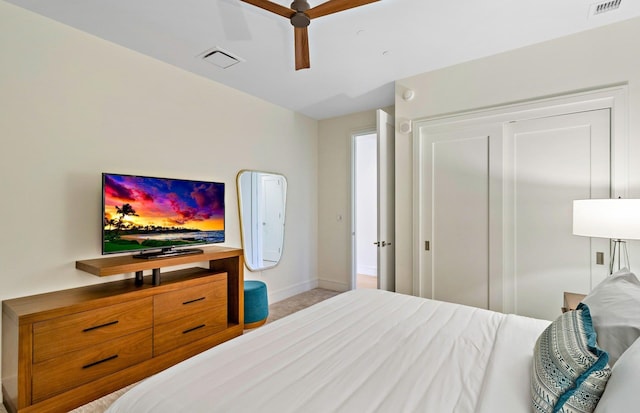 carpeted bedroom featuring ceiling fan