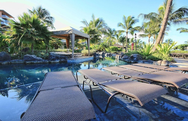 view of pool featuring a water view