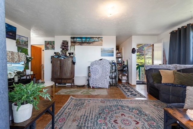 living room with a textured ceiling