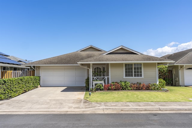 ranch-style house with a front yard and a garage