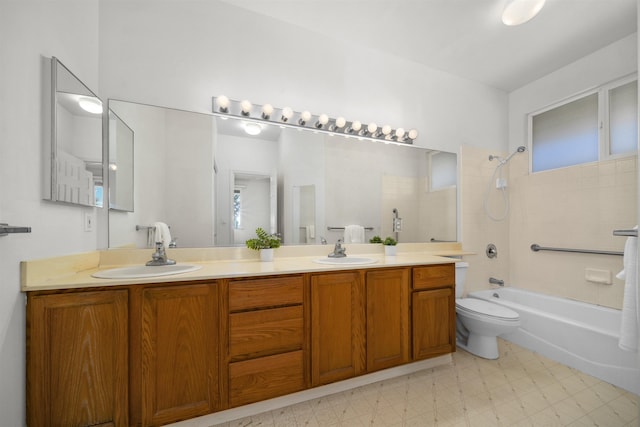 full bathroom with tiled shower / bath combo, vanity, and toilet