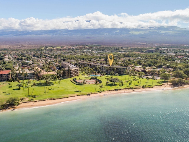 drone / aerial view with a beach view and a water view