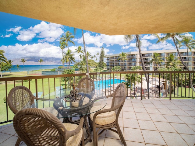 balcony with a water and mountain view