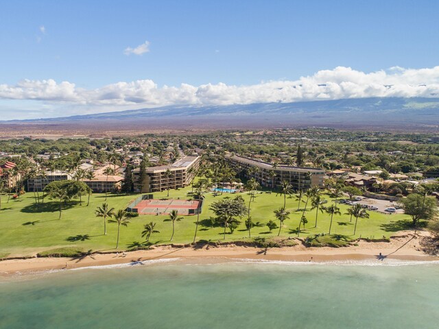 birds eye view of property with a view of the beach and a water view