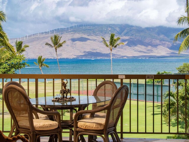 balcony with a water and mountain view