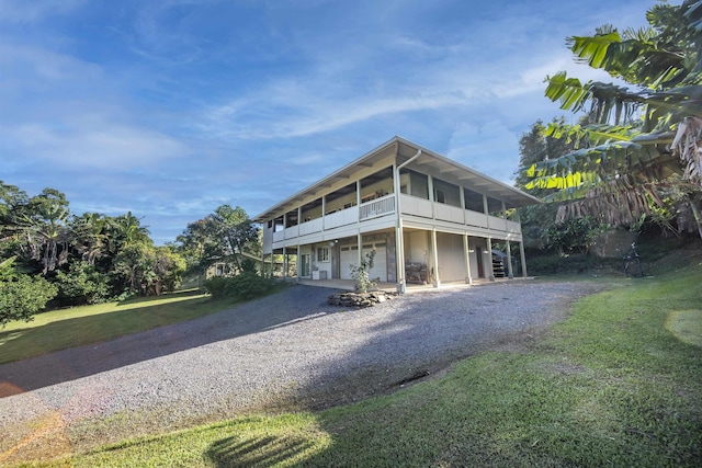 view of front of home with a garage and a front lawn