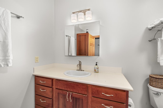 bathroom with vanity and toilet