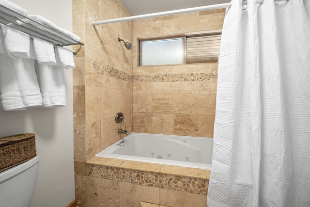 bathroom with shower / bath combination with curtain and toilet