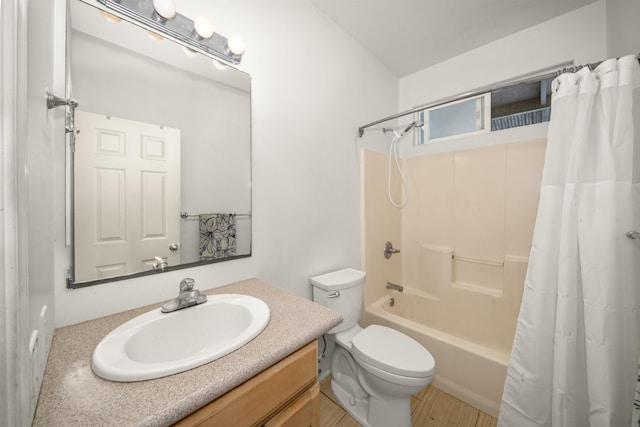 full bathroom with shower / tub combo, vanity, toilet, and hardwood / wood-style floors