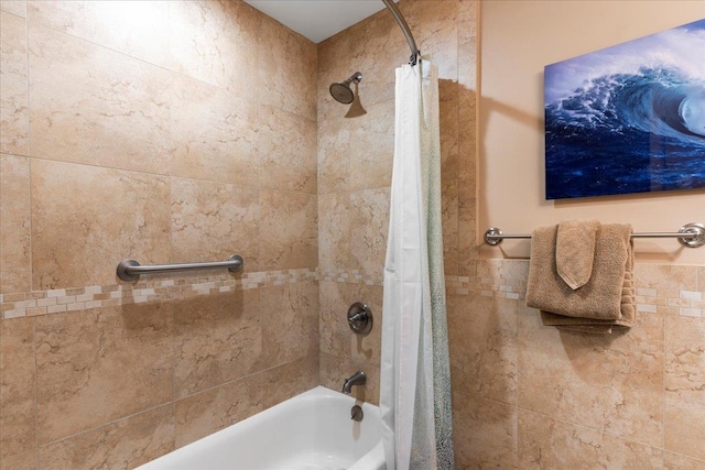 bathroom with shower / bath combination with curtain