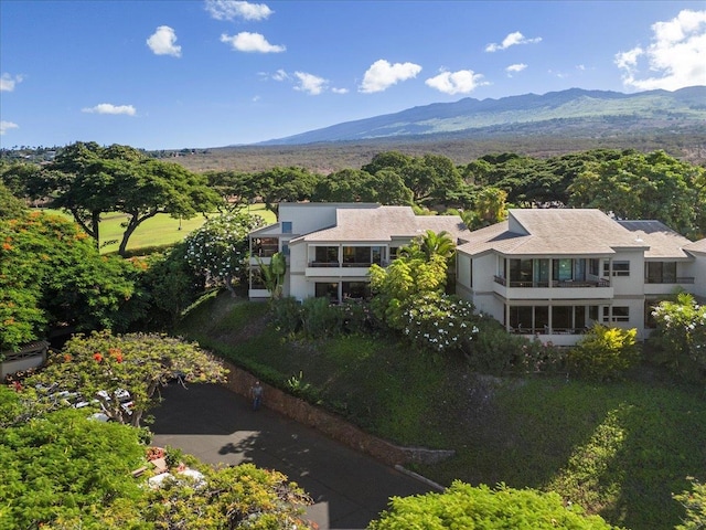 birds eye view of property with a mountain view