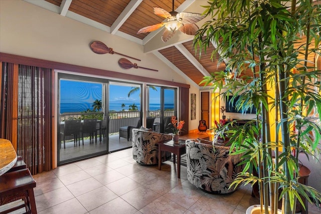 sunroom featuring a water view, wood ceiling, lofted ceiling with beams, and ceiling fan