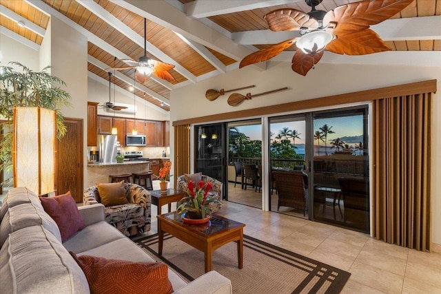 living room featuring beam ceiling, ceiling fan, light tile patterned floors, high vaulted ceiling, and wooden ceiling