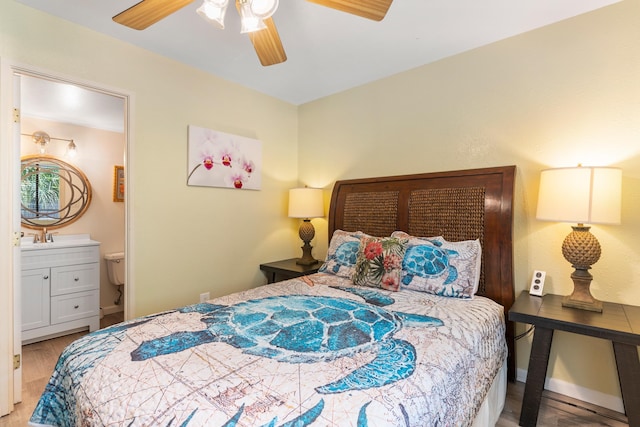 bedroom with connected bathroom, ceiling fan, and hardwood / wood-style flooring