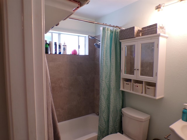 bathroom with toilet and shower / tub combo with curtain