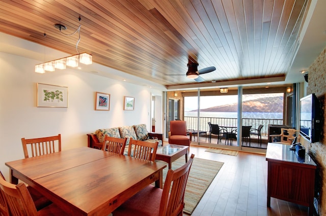 dining space with a wealth of natural light, ceiling fan, and wooden ceiling