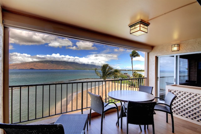 balcony with a water and mountain view