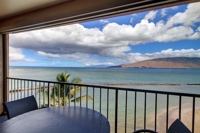 balcony with a water and mountain view