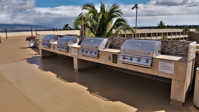 view of terrace featuring area for grilling and exterior kitchen