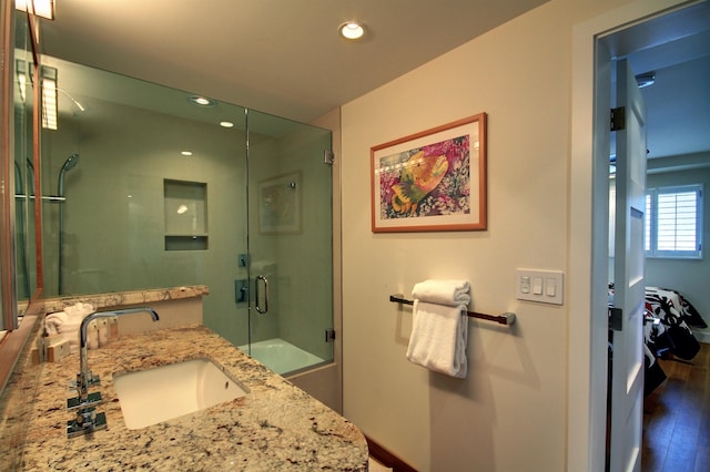 bathroom featuring vanity and hardwood / wood-style flooring