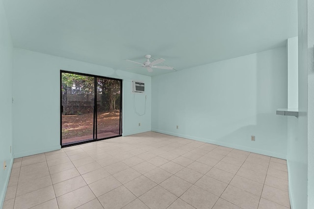 2747 S Kihei Rd Unit D102, Kihei, HI 96753 - empty room featuring ceiling fan, an AC wall unit, baseboards, and light tile patterned floors