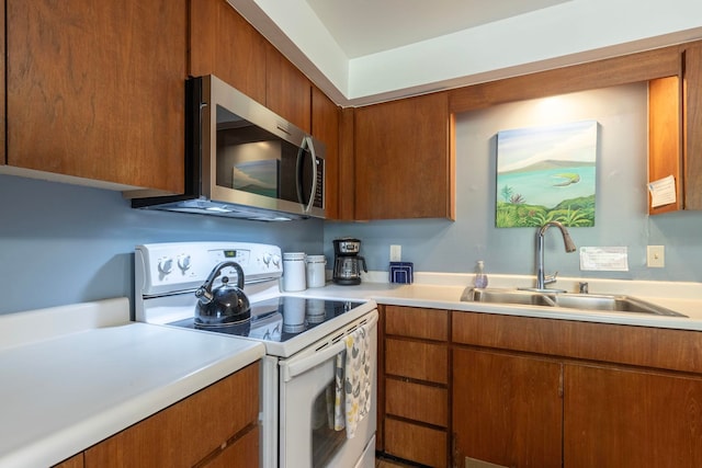 kitchen with sink and white range with electric stovetop