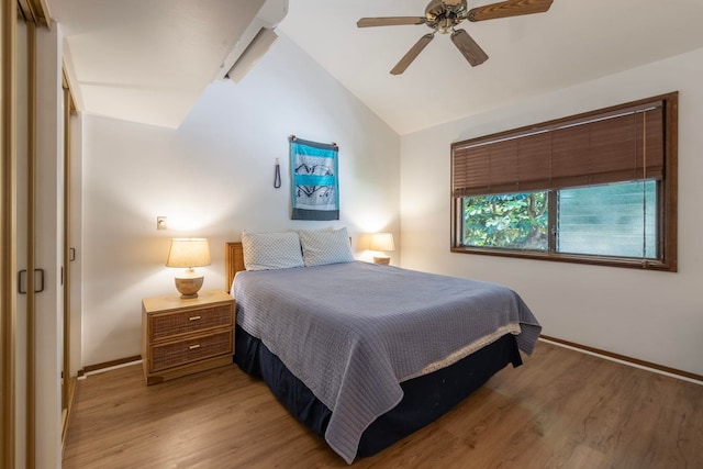 bedroom featuring vaulted ceiling, ceiling fan, and hardwood / wood-style flooring