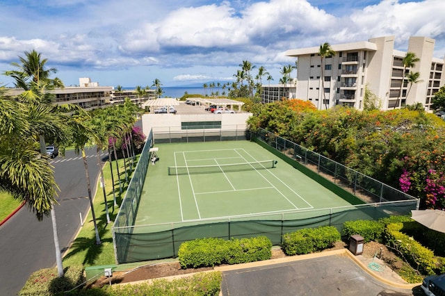 view of sport court with a water view