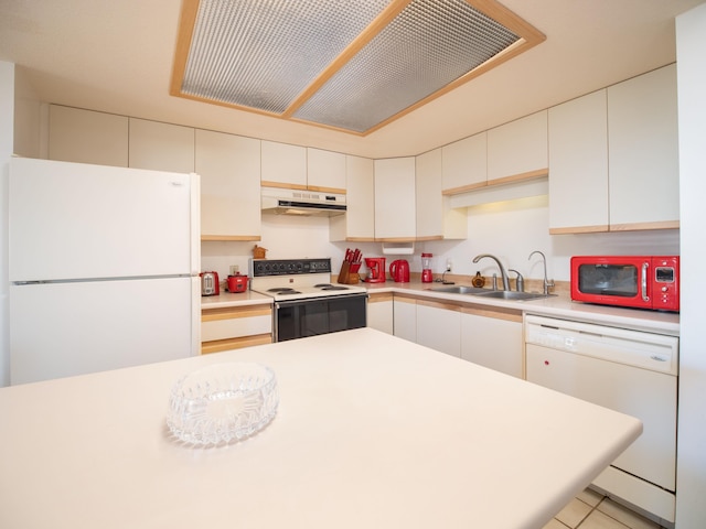 kitchen featuring white cabinets, light tile patterned flooring, white appliances, and sink