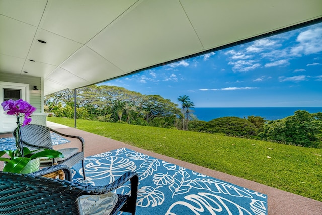 view of patio with a water view