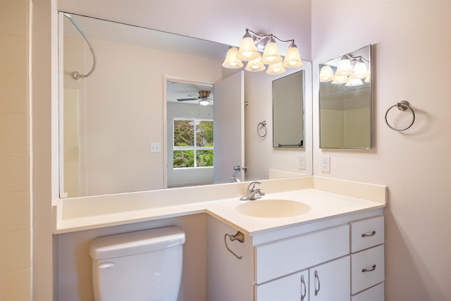 bathroom with vanity, toilet, and ceiling fan