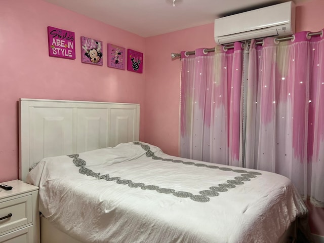 bedroom featuring a closet and a wall mounted AC