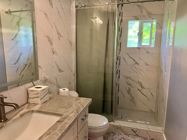 bathroom featuring a shower with curtain, vanity, tile walls, and toilet