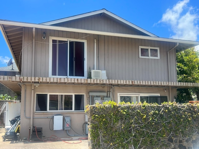 exterior space featuring an AC wall unit