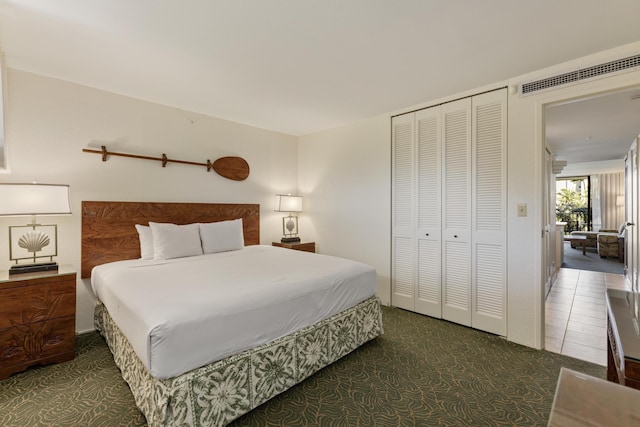 bedroom with visible vents and a closet