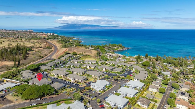 birds eye view of property with a water and mountain view