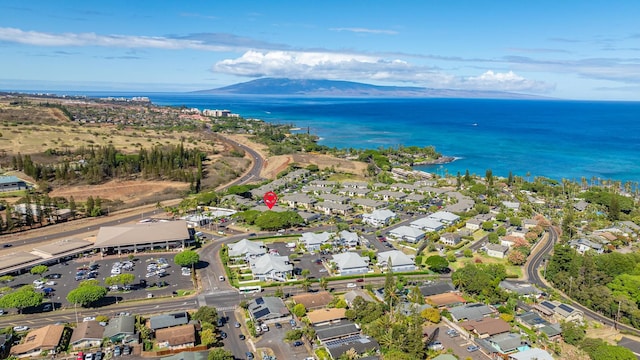 aerial view featuring a water and mountain view