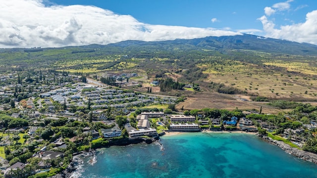 aerial view featuring a water and mountain view